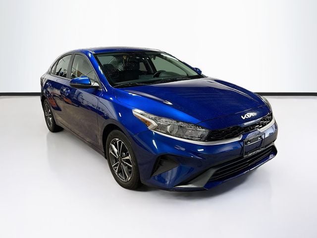 2024 Kia Forte LXS in Deep Sea Blue — front three-quarter view