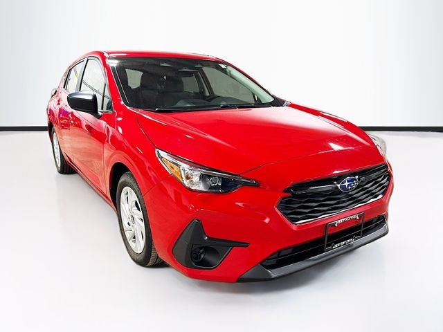 2024 Subaru Impreza Base in Pure Red — front three-quarter view