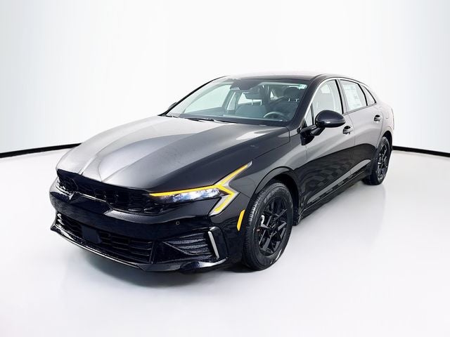 2026 Kia K5 LXS in Aurora Black Pearl — front three-quarter view