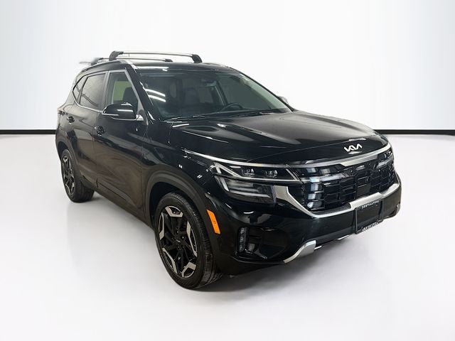 2024 Kia Seltos SX in Fusion Black — front three-quarter view